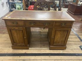 A good quality vintage desk on two pedestals. With three draws & two under cupboards. 122cm x 57cm x