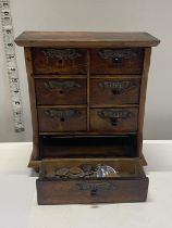 An antique wooden spice cabinet. (some draw knobs missing) 23cm x 20cm