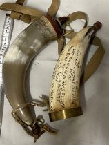 Two vintage black powder horns