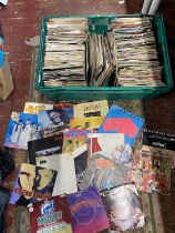 A job lot of mixed genre 7" singles, shipping unavailable