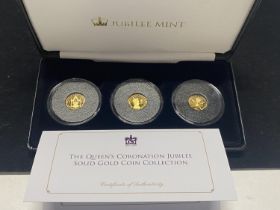 A limited edition cased set of three 9ct gold proof coins celebrating the Queen's Coronation jubilee