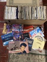 A job lot of mixed genre 7" singles, shipping unavailable