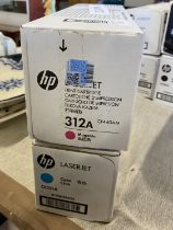 Two HP Laserjet ink cartridges, one magenta one cyan