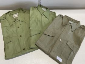 Three 1950s army issue officers jungle shirts two by J G Plumb and one Van Heusen