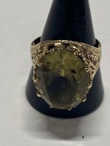 A antique hallmarked 9ct gold ring with large central citrine. Size V. Gross weight 7.55 grams