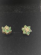 A pair of 9ct gold, emeralds & diamond earrings.