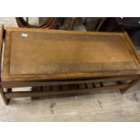 A vintage mid century coffee table with an unusual copper insert to the top. 117cm x 50cm. No