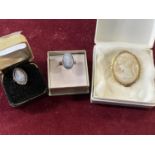 A vintage gold tone cameo brooch and two Wedgewood rings (one silver)