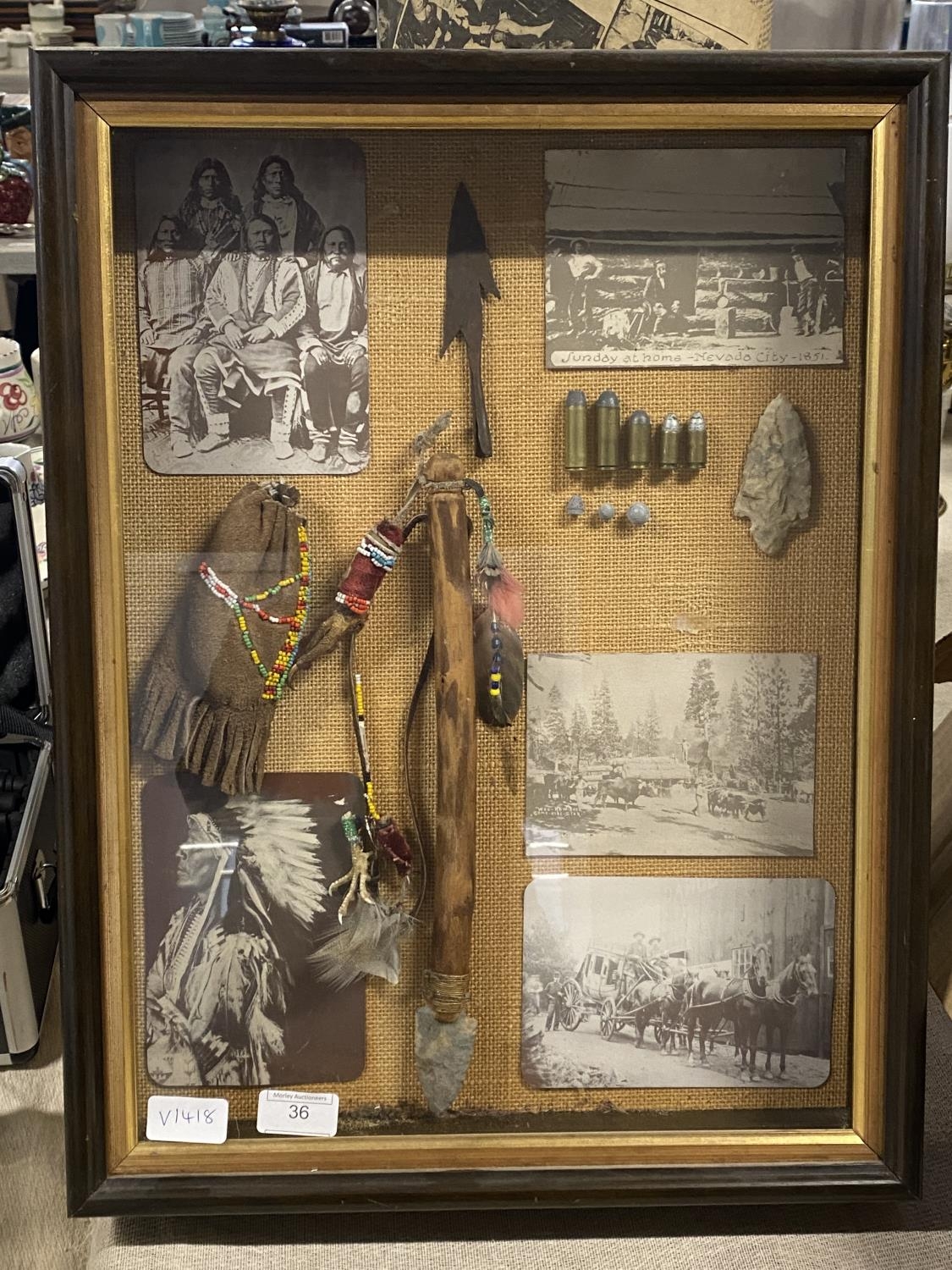 A glazed display case of Native American artifacts etc Case size 58cm x 40cm shipping unavailable