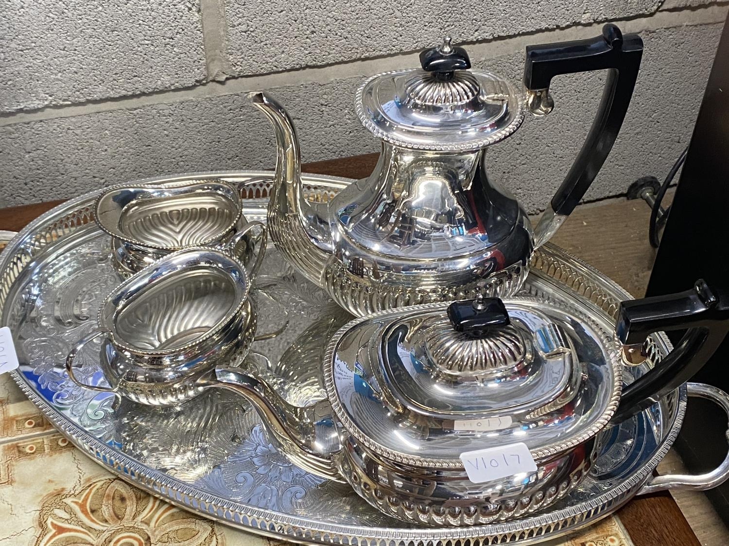 A good quality silver plated four piece tea service with a galleried tray. shipping unavailable