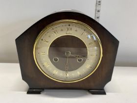 A vintage mantle clock with key and pendulum, shipping unavailable