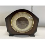 A vintage mantle clock with key and pendulum, shipping unavailable