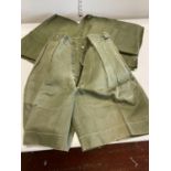 Two pairs of 1950s army issue jungle shorts and one pair of 1950 pattern army issue jungle trousers