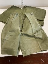 Two pairs of 1950s army issue jungle shorts and one pair of 1950 pattern army issue jungle trousers