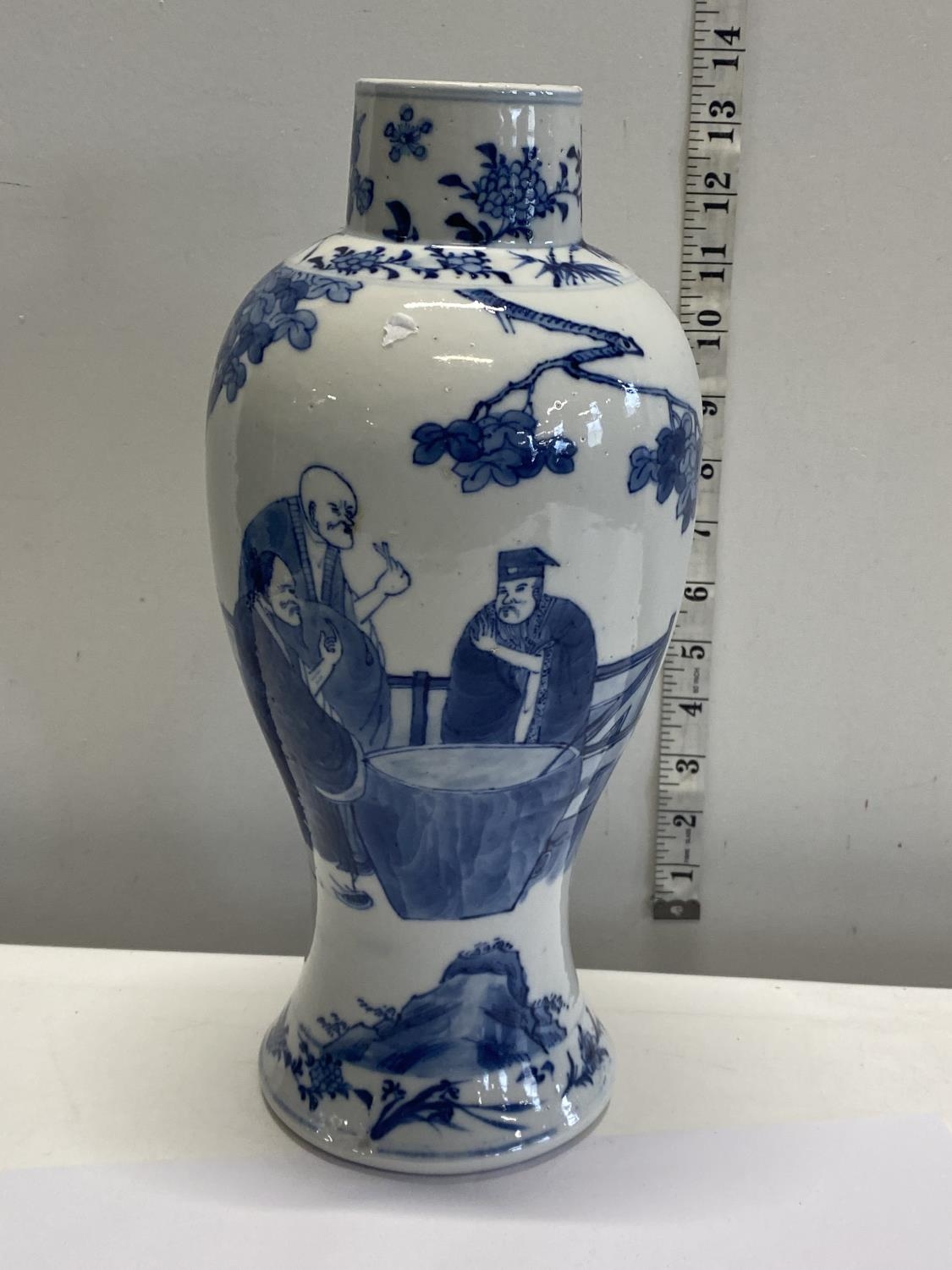 A large Chinese blue and white porcelain vase (damage to rim) and four character marks to the base