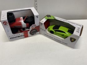 One remote control three wheel racer and a remote control Lamborghini (untested)