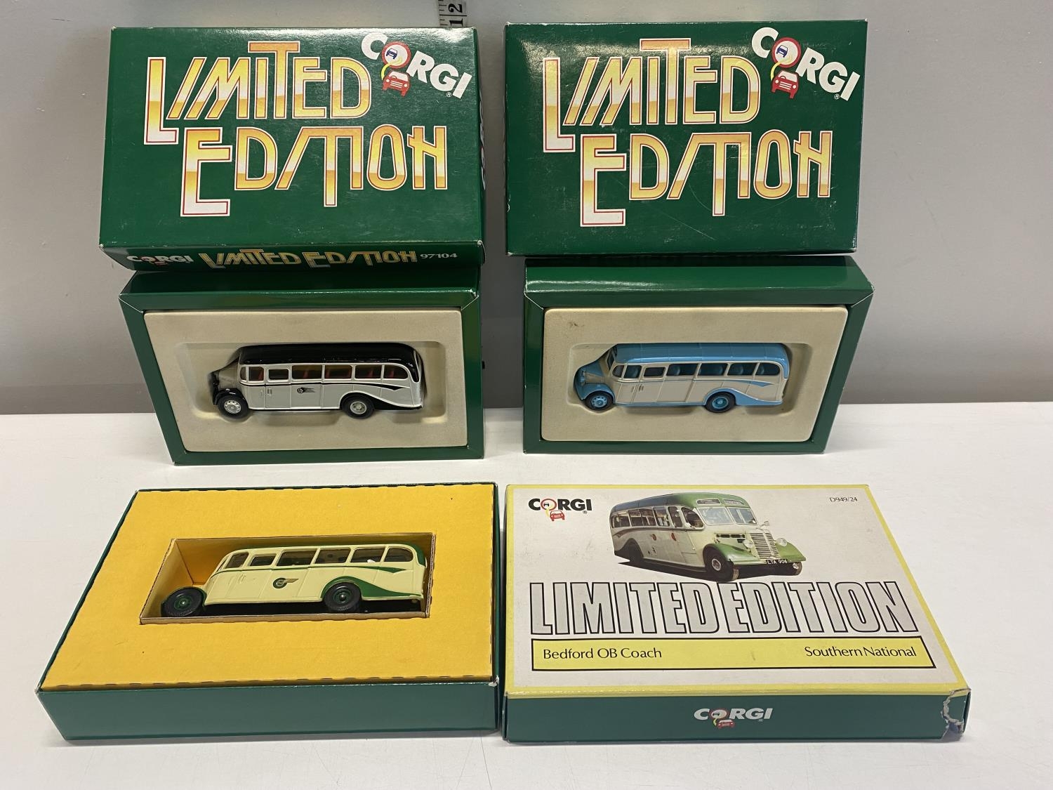 Three boxed limited edition Corgi die-cast buses