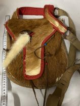 A vintage native Indian style hand sewn hunting shoulder bag made from animal hide