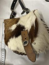 A vintage native Indian style hand sewn hunting shoulder bag made from animal hide