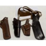 A selection of assorted leather pistol and hunting knife holders/sheaths