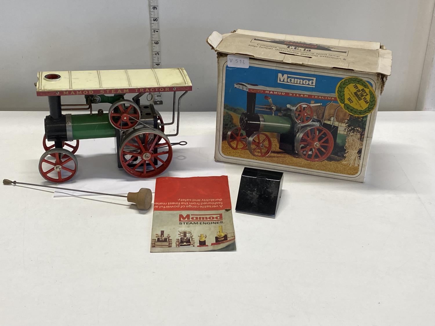 A vintage boxed Mamod steam tractor