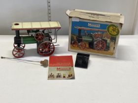 A vintage boxed Mamod steam tractor