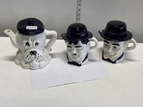 Three novelty tea pots including Laurel and Hardy, shipping unavailable