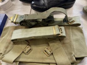 A selection vintage military kit including a WW2 period jungle belt and a 1944 dated satchel