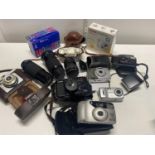 A job lot of assorted vintage cameras and 35mm lenses