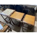 A set of three mid century nesting tables, the largest has a tiled top. No shipping.