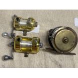 Three small brass fishing reels