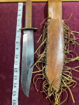 An original Bowie knife in a leather sheath. Blade stamped Sussex Armoury. Blade length 25cm over