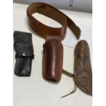 A vintage leather belt and holster and two leather hunting knife sheath's