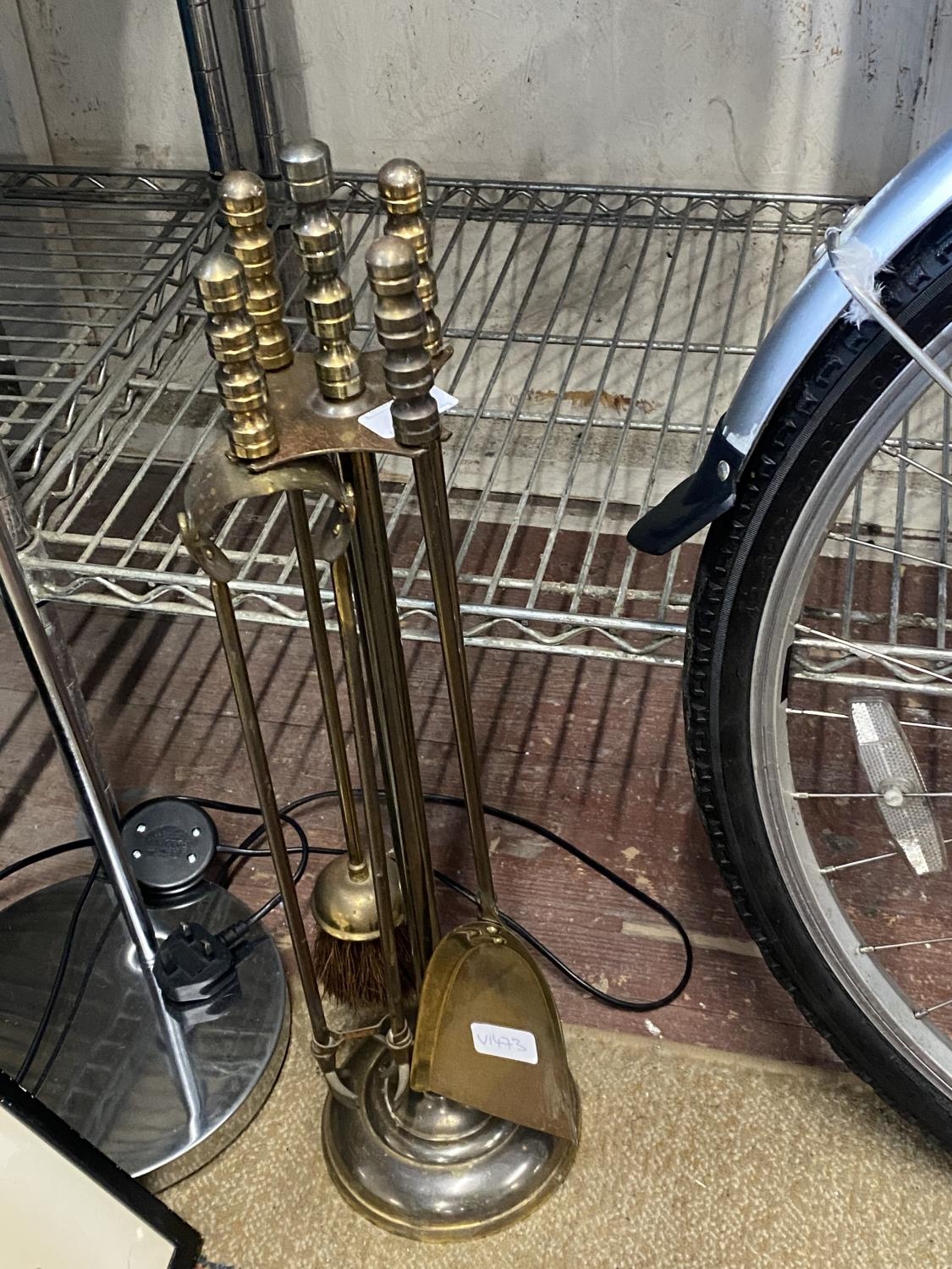 A vintage brass fireside companion set, shipping unavailable