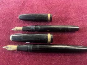 Two vintage fountain pens both with 14ct gold nibs