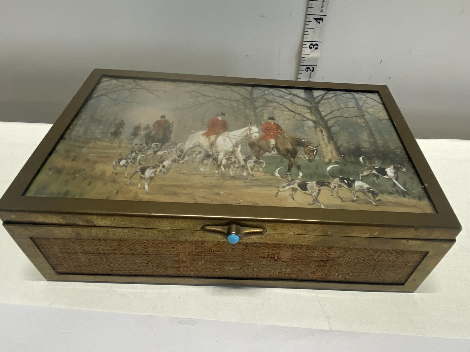 A bronze and wooden hunting themed box with a hand painted lid 23x14cm