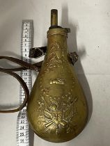 A reproduction U. S. Model 1855 Peace & Friendship, brass black powder flask