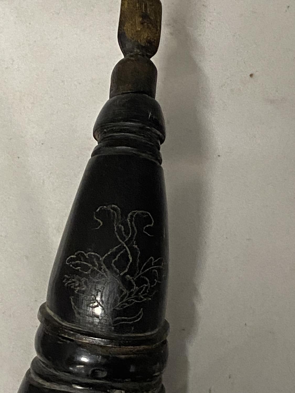A vintage black powder horn with leather strap (needs re-attaching one end) - Image 2 of 2