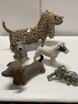 A selection of assorted dog figures, shipping unavailable