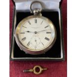 A hallmarked silver pocket watch with key retailed by Harris Stone of Leeds (not running)