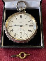 A hallmarked silver pocket watch with key retailed by Harris Stone of Leeds (not running)