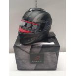 A New boxed black motorcycle helmet. Size XL