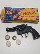 A boxed vintage "The Outlaw Patrol Police Pistol"