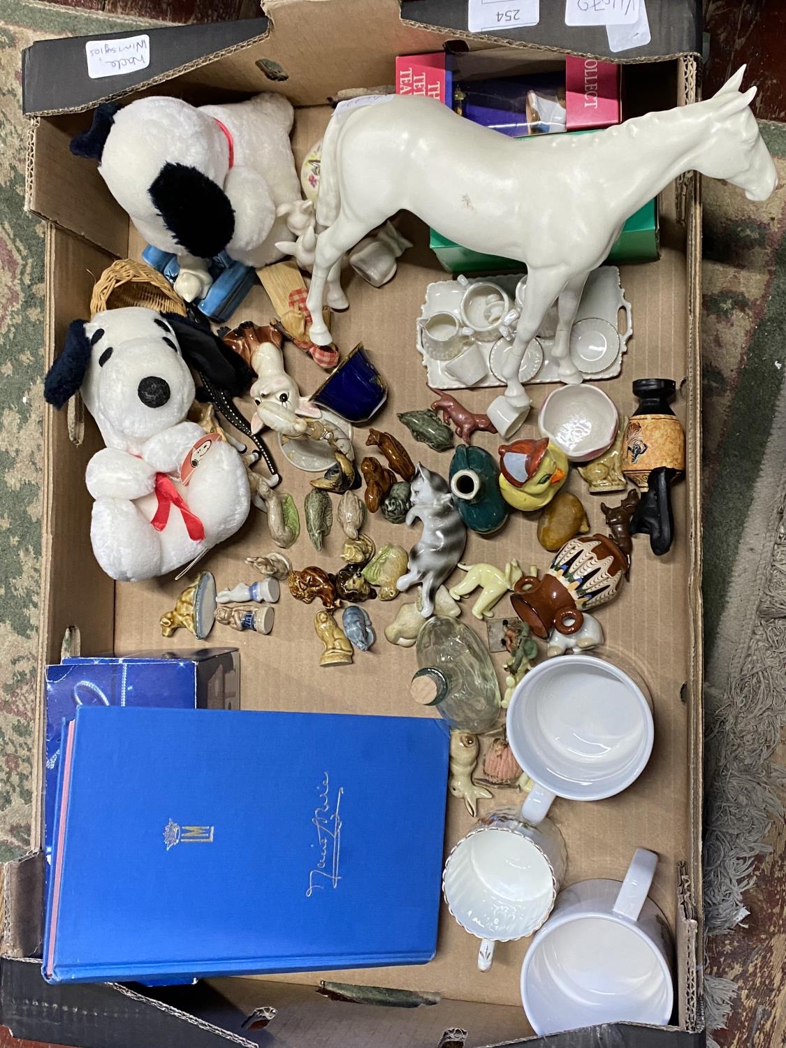 A box full of assorted collectables including a good selection of Wade Whimsies. Shipping
