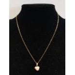 A 9ct Gold chain and pendant. 1.93g