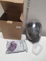 A boxed filtration mask and spare filters