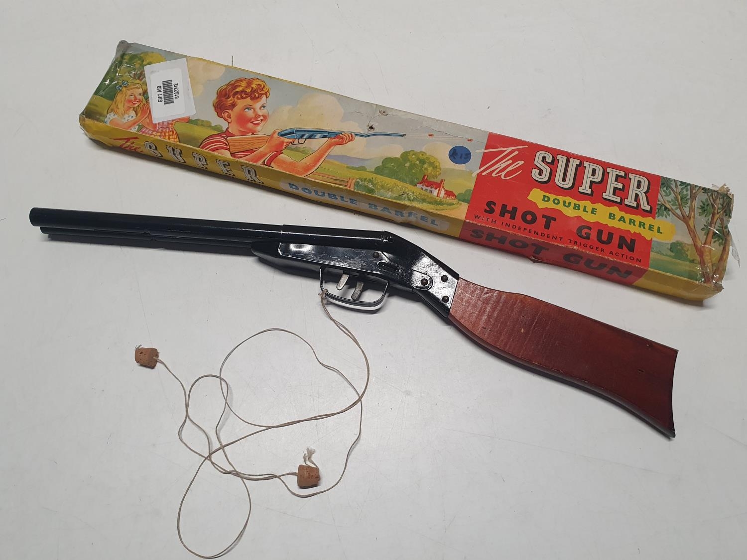 A boxed vintage pop gun "The Super Double Barrel Shotgun"