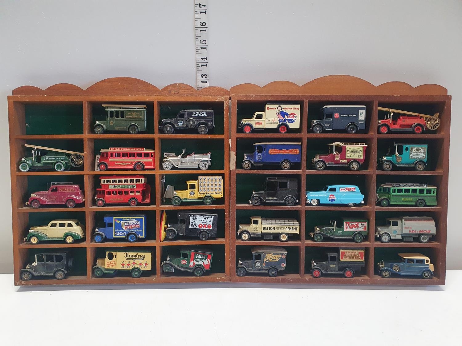 A selection of die cast models in display cases, shipping unavailable