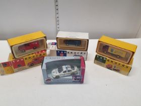 Four boxed die cast models including Vanguards