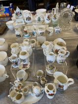 A large job lot of assorted crested wares including the stands. Shipping unavailable